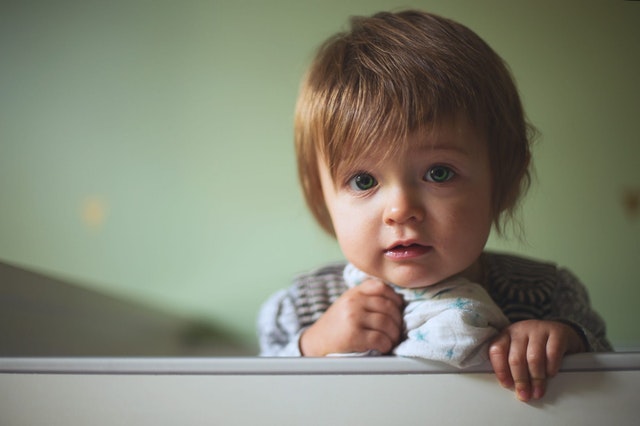 toddler indoors smiling